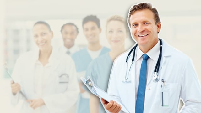 A doctor superimposed over a blurred background of other health care professionals to help illustrate RVU medical billing.