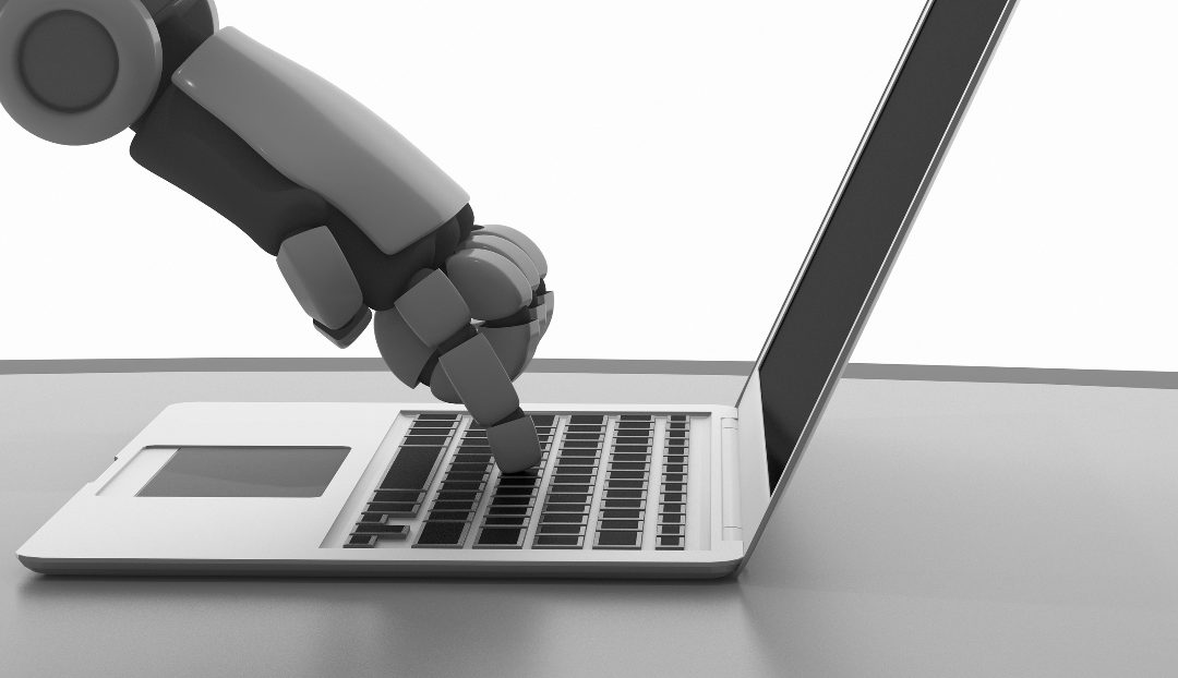 Robot arm touching laptop keyboard | Business Intelligence Programs