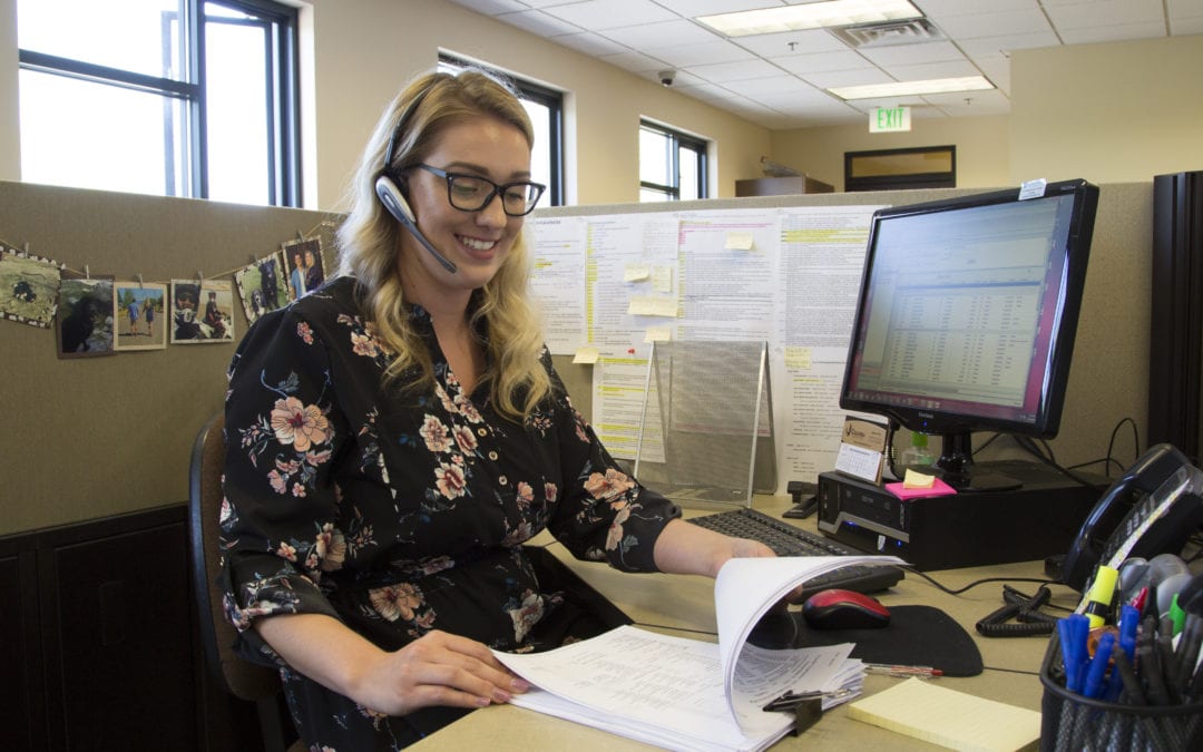 A woman sitting at her computer to help illustrate what is medical billing