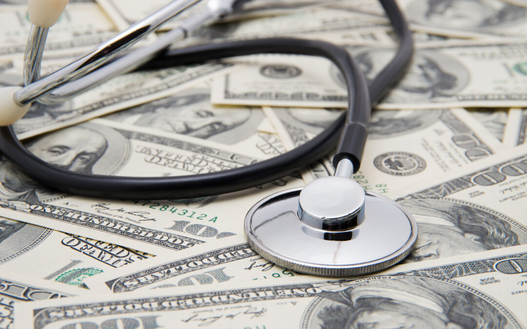 A stethoscope on a pile of money to illustrate richest hospitals in the US