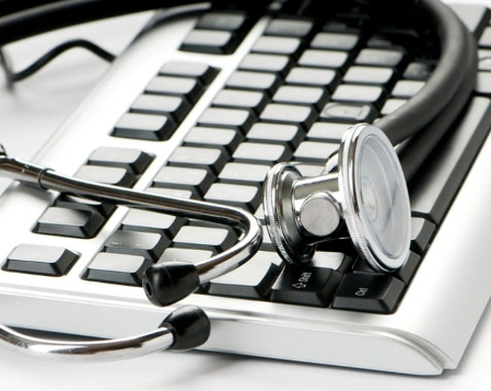 A stethoscope on a keyboard to help illustrate Medical IT Services.
